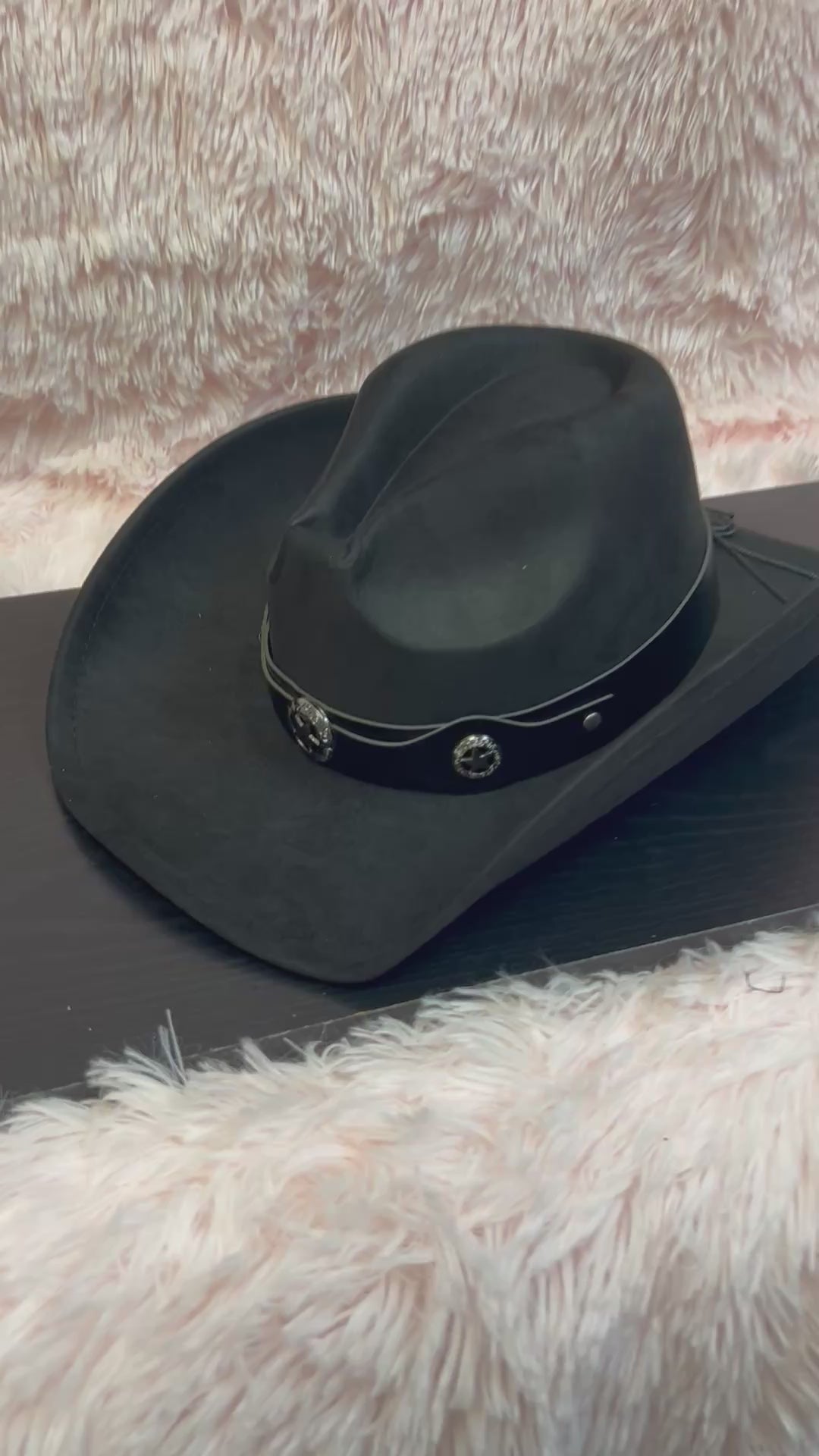 -faux suede cowboy hat in black

-black faux leather band with gunmetal stars detail

-interior ribbon inside hat to customize size

-stiff, sturdy structure
