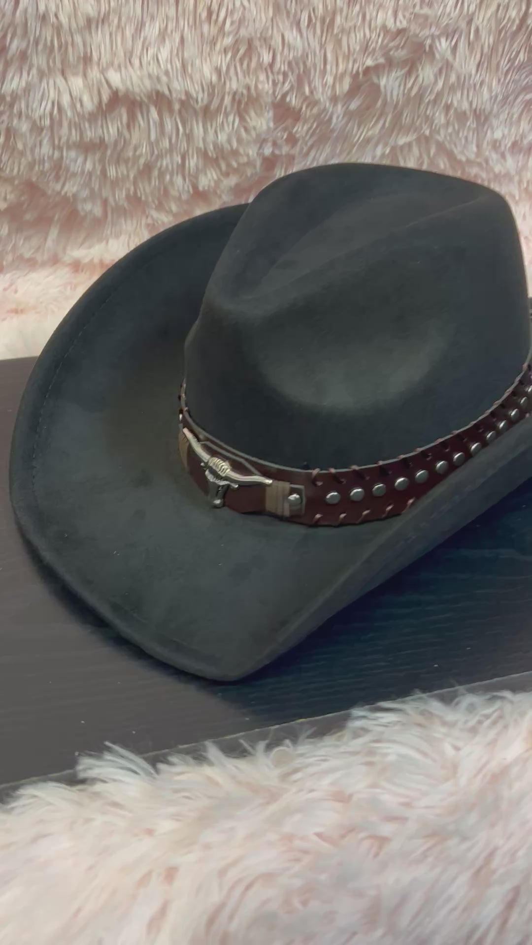-faux suede cowboy hat in black

-brown faux leather band with silver studs and bull detail

-interior ribbon inside hat to customize size

-stiff, sturdy structure