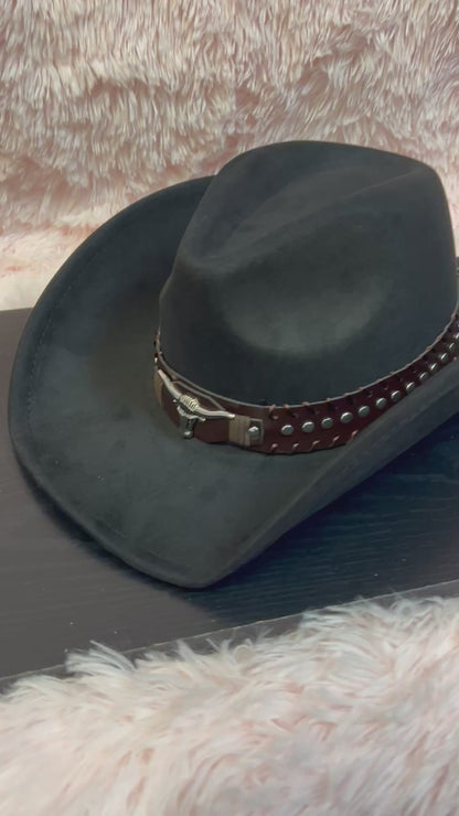 -faux suede cowboy hat in black

-brown faux leather band with silver studs and bull detail

-interior ribbon inside hat to customize size

-stiff, sturdy structure