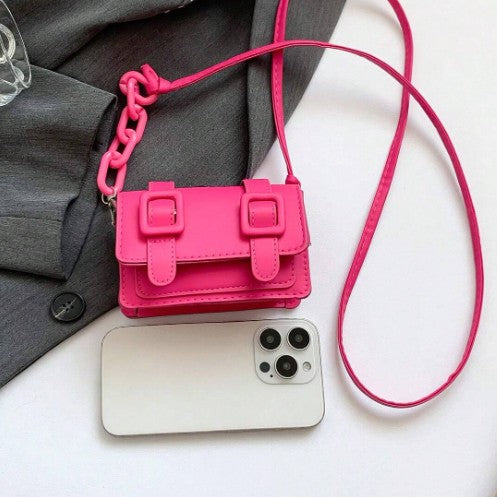 TRINA HOT PINK MINI BAG WITH DOUBLE BUCKLE DESIGN AND CROSS BODY STRAP