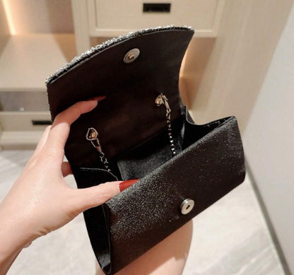 SERINA BLACK SATIN PLEATED CLUTCH WITH SILVER JEWEL ENCRUSED TRIM AND OPTIONAL CHAIN STRAP
