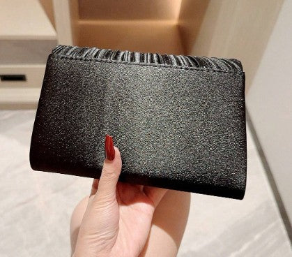SERINA BLACK SATIN PLEATED CLUTCH WITH SILVER JEWEL ENCRUSED TRIM AND OPTIONAL CHAIN STRAP