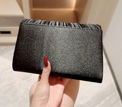 SERINA BLACK SATIN PLEATED CLUTCH WITH SILVER JEWEL ENCRUSED TRIM AND OPTIONAL CHAIN STRAP