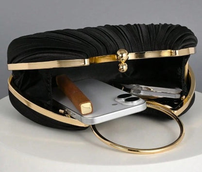 SYBIL BLACK SATIN PLEATED HARD CASE CLUTCH WITH GOLD TRIM AND HANDLE AND OPTIONAL GOLD CHAIN STRAP