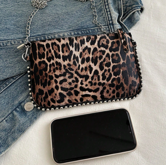 TARA LEOPARD FAUX LEATHER RECTANGULAR CLUTCH WITH SILVER STUDDED BORDER AND REMOVEABLE CHAIN STRAP