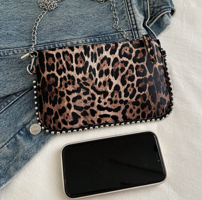 TARA LEOPARD FAUX LEATHER RECTANGULAR CLUTCH WITH SILVER STUDDED BORDER AND REMOVEABLE CHAIN STRAP
