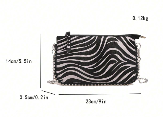 TARA ZEBRA FAUX LEATHER RECTANGULAR CLUTCH WITH SILVER STUDDED BORDER AND REMOVEABLE CHAIN STRAP