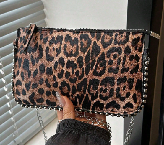 TARA LEOPARD FAUX LEATHER RECTANGULAR CLUTCH WITH SILVER STUDDED BORDER AND REMOVEABLE CHAIN STRAP