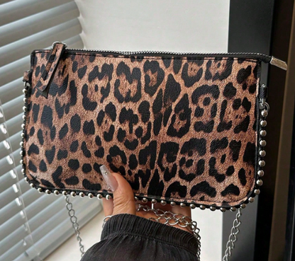 TARA LEOPARD FAUX LEATHER RECTANGULAR CLUTCH WITH SILVER STUDDED BORDER AND REMOVEABLE CHAIN STRAP