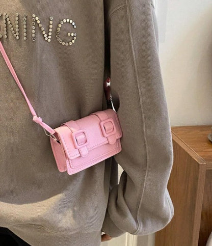 TRINA BABY PINK MINI BAG WITH DOUBLE BUCKLE DESIGN AND CROSS BODY STRAP (Copy)