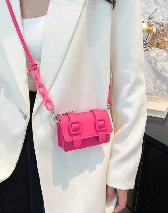 TRINA HOT PINK MINI BAG WITH DOUBLE BUCKLE DESIGN AND CROSS BODY STRAP