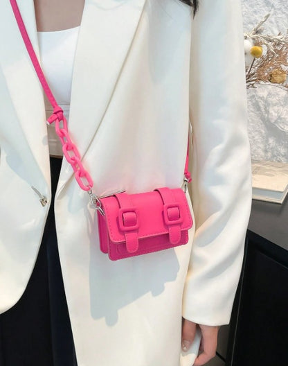TRINA HOT PINK MINI BAG WITH DOUBLE BUCKLE DESIGN AND CROSS BODY STRAP