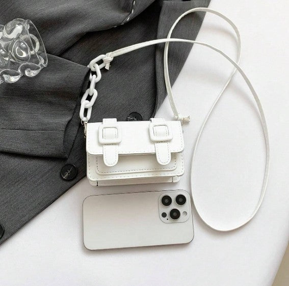 TRINA WHITE MINI BAG WITH DOUBLE BUCKLE DESIGN AND CROSS BODY STRAP