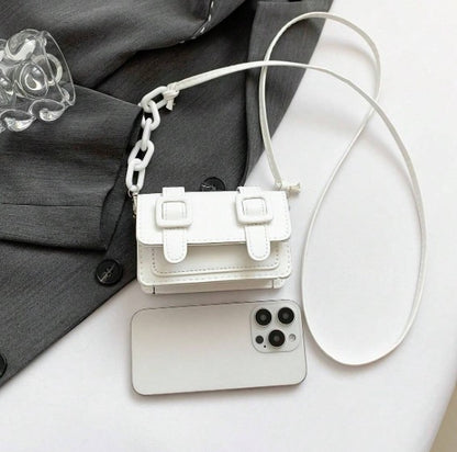 TRINA WHITE MINI BAG WITH DOUBLE BUCKLE DESIGN AND CROSS BODY STRAP