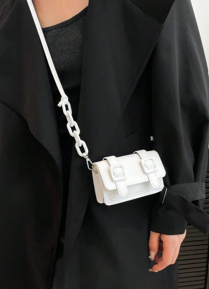 TRINA WHITE MINI BAG WITH DOUBLE BUCKLE DESIGN AND CROSS BODY STRAP