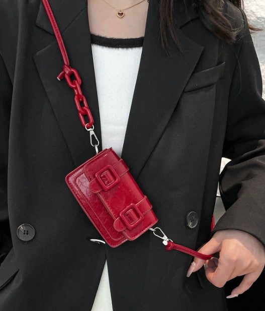 TRINA WINE MINI BAG WITH DOUBLE BUCKLE DESIGN AND CROSS BODY STRAP