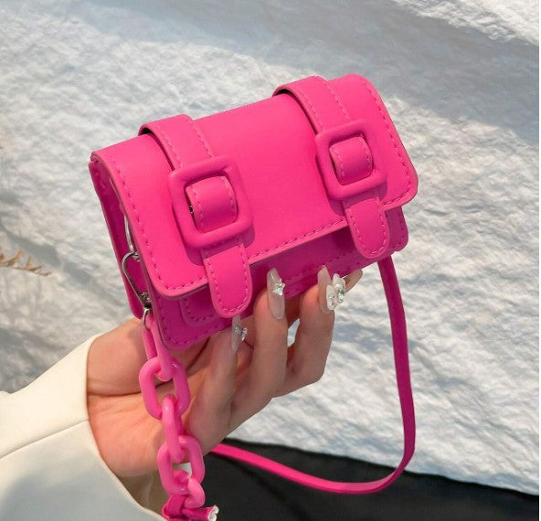 TRINA HOT PINK MINI BAG WITH DOUBLE BUCKLE DESIGN AND CROSS BODY STRAP