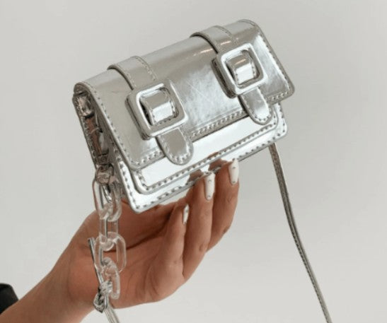 TRINA SILVER MINI BAG WITH DOUBLE BUCKLE DESIGN AND CROSS BODY STRAP