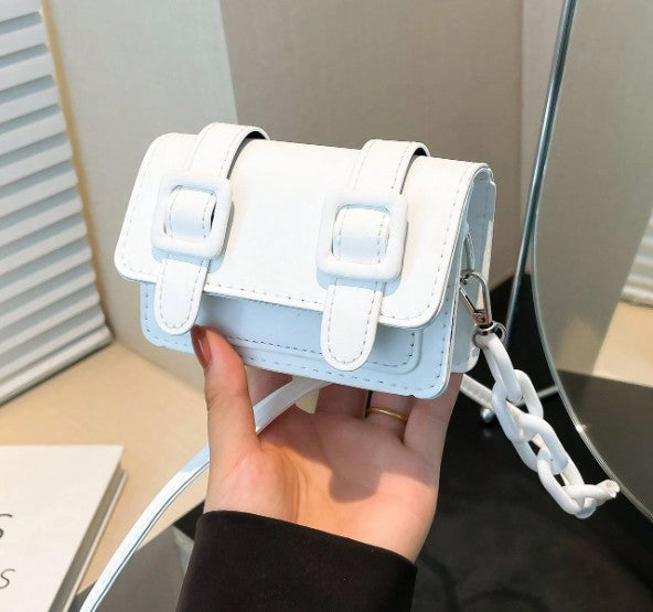 TRINA WHITE MINI BAG WITH DOUBLE BUCKLE DESIGN AND CROSS BODY STRAP