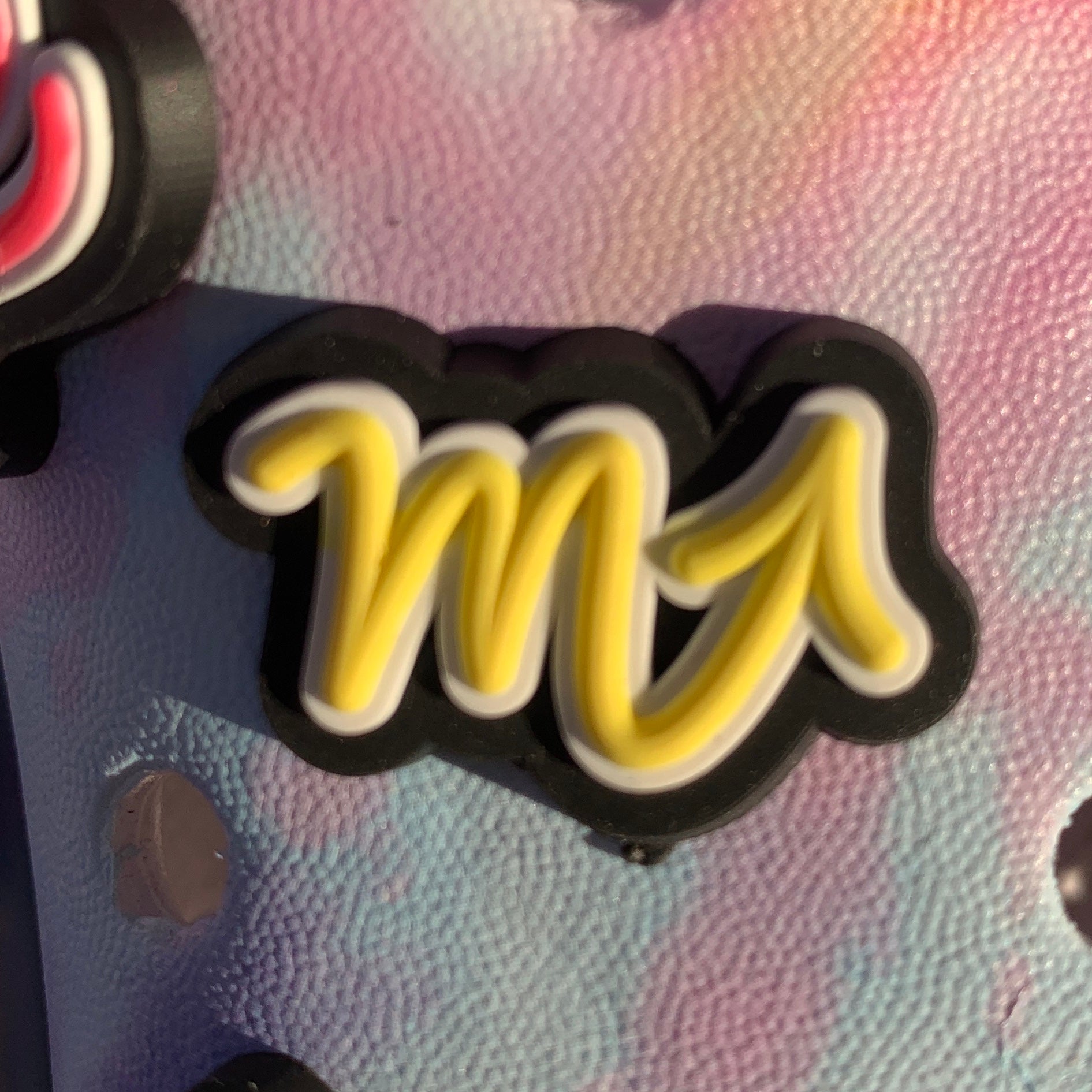 a pair of yellow scissors on a table 