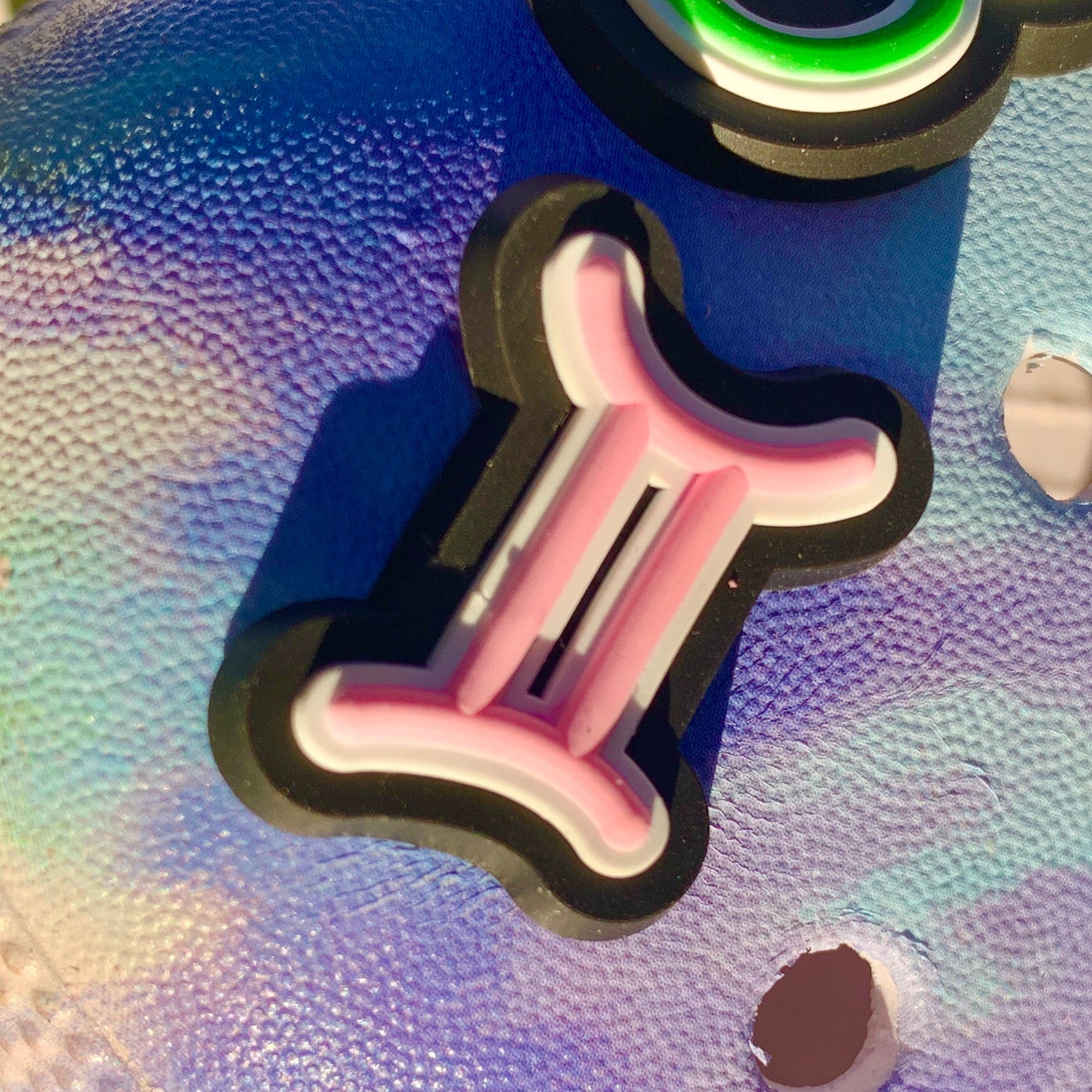 a pair of scissors sitting on top of a cloth 