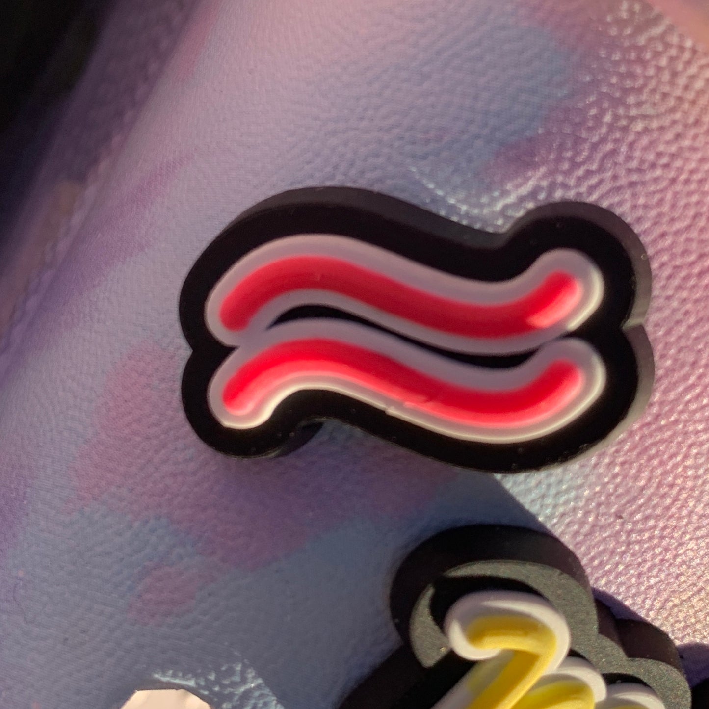 a pair of scissors sitting next to a pair of scissors 