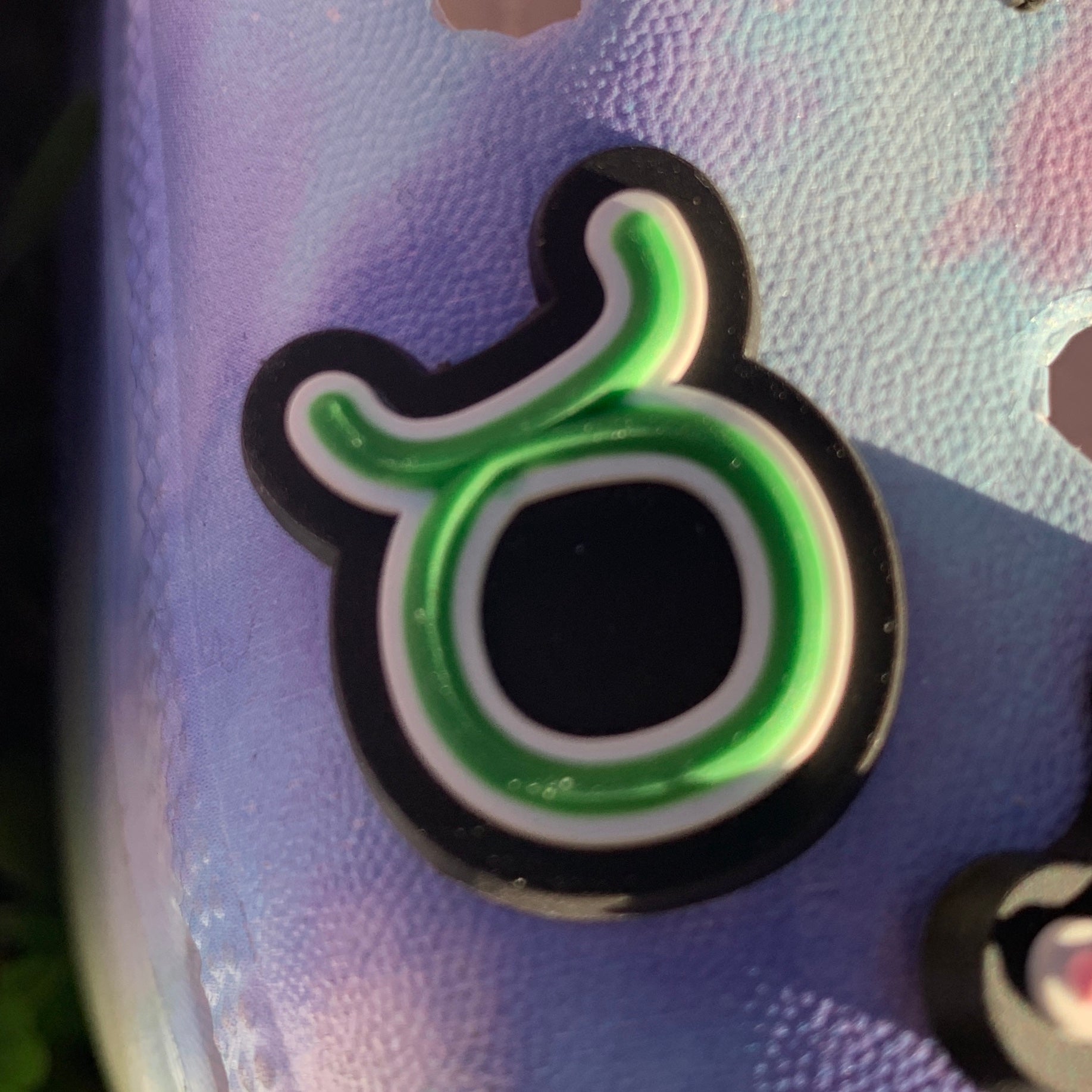 a close up of a pair of green scissors 